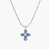 Silver necklace with blue gemstone cross pendant, centered white crystal, on a white background.