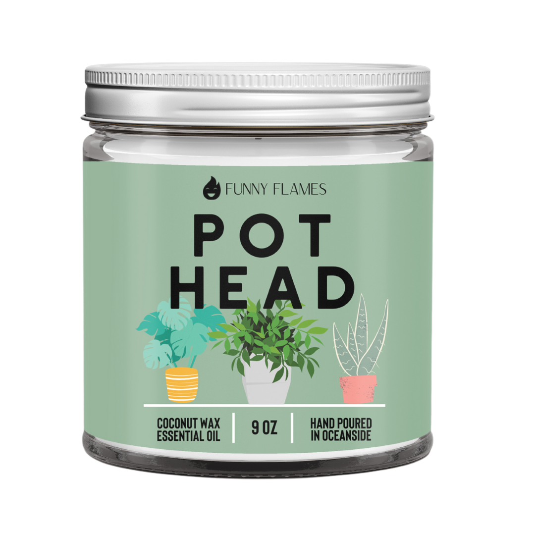 A mint green candle jar with "Pot Head," plant graphics, and a silver lid. 9 oz, coconut wax.