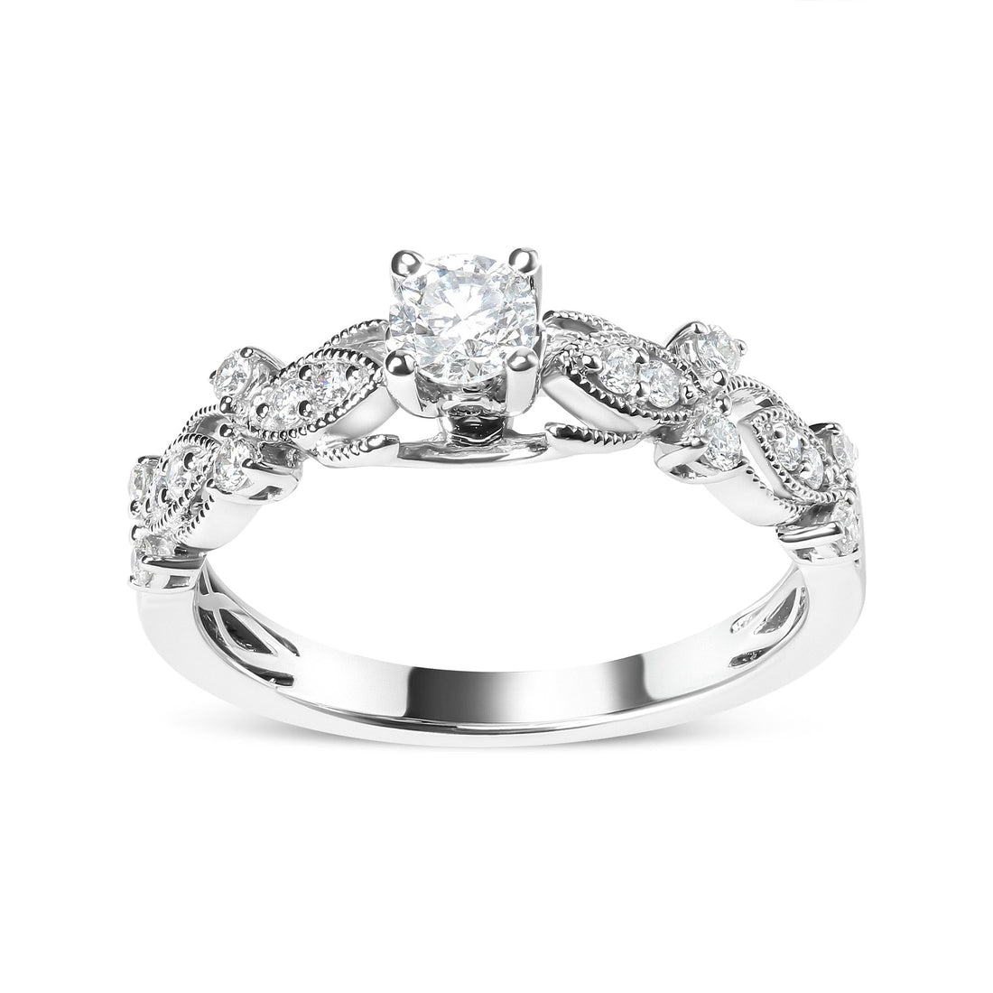 Engagement ring with a round diamond, floral detail, silver band, and accent stones.