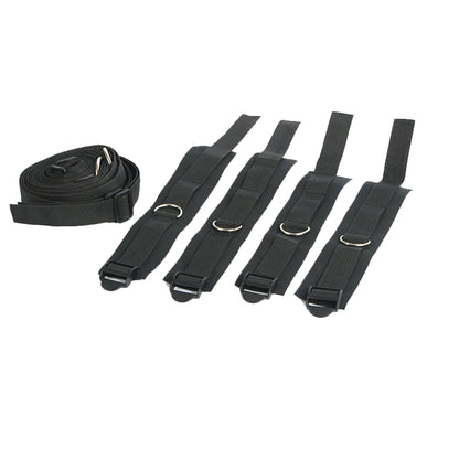 Five black adjustable straps with metal rings, one rolled and four laid flat.
