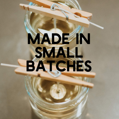 Clothespins balance on jars of wax with "Made in Small Batches" text overlay.