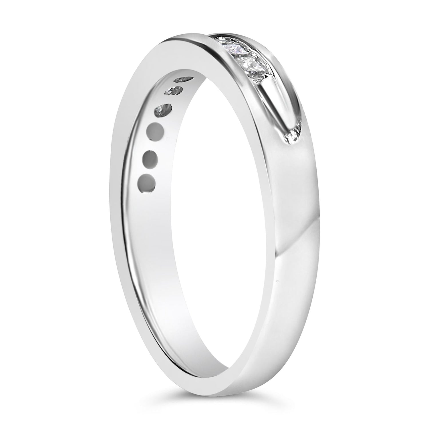 Silver ring with a polished finish and embedded small diamond, viewed at an angle on white background.