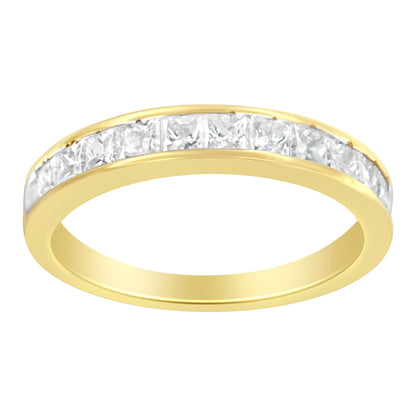 Gold ring with clear rectangular stones set in an inlaid channel across the top.
