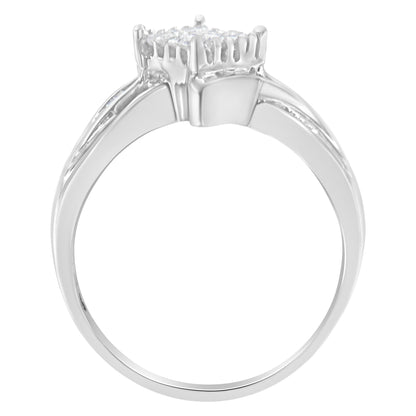 Silver ring with a round diamond cluster on top, sleek and shiny band.