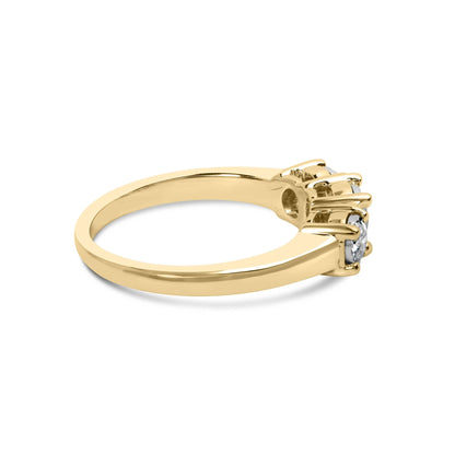 Gold ring with three round diamonds in prong settings, shown from the side view.