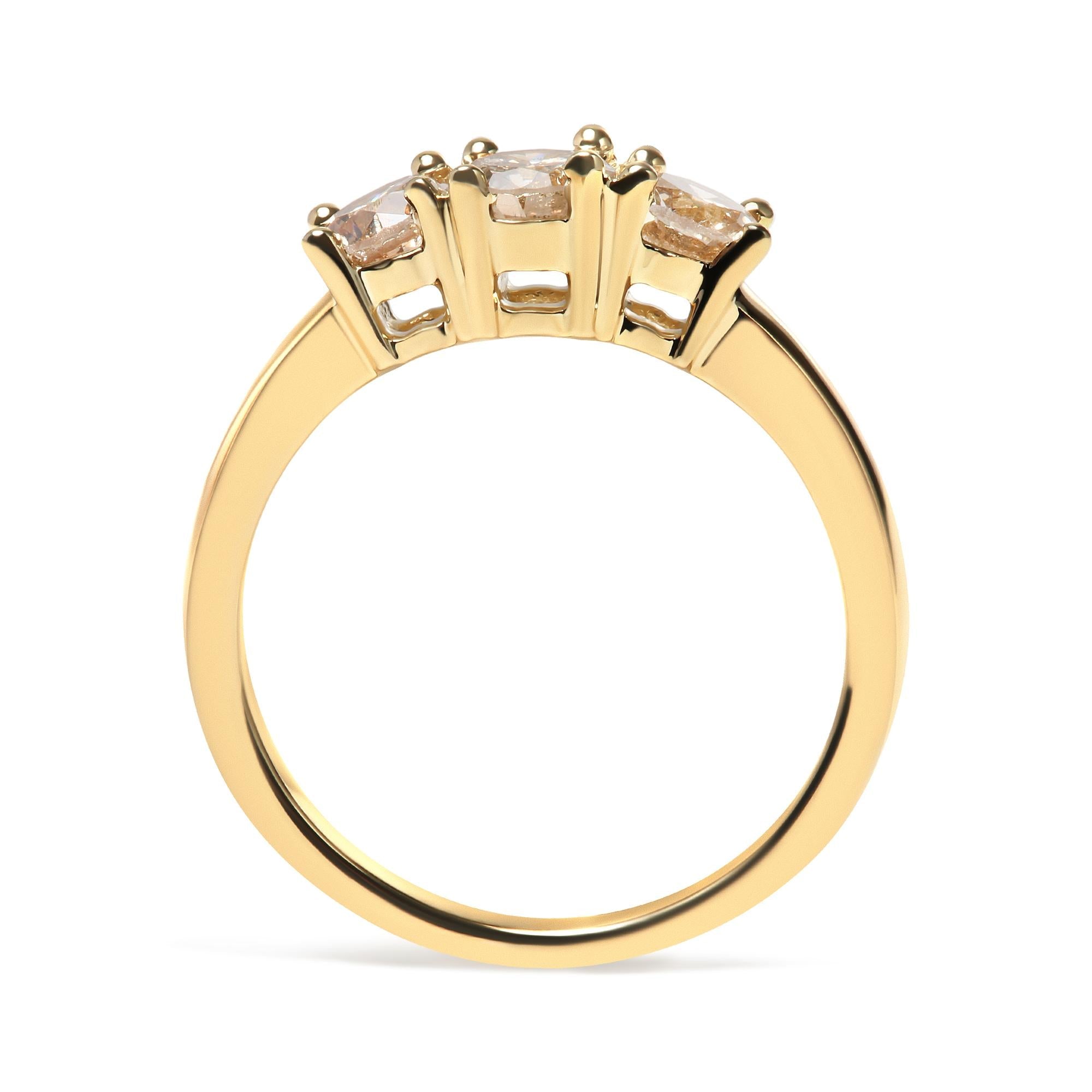 Gold ring with four diamond prongs side view; smooth band, intricate setting.