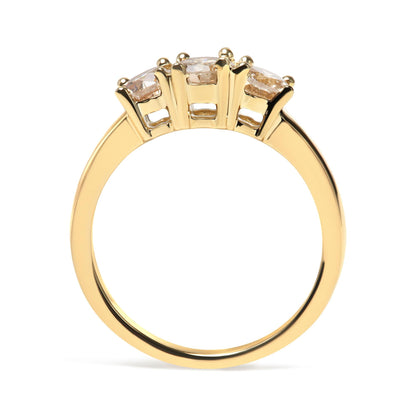 Gold ring with four diamond prongs side view; smooth band, intricate setting.