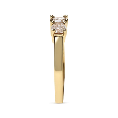 Gold ring with two side-by-side round diamonds, set in a prong setting, viewed from side.
