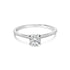 Silver ring with a single round diamond on a white background.