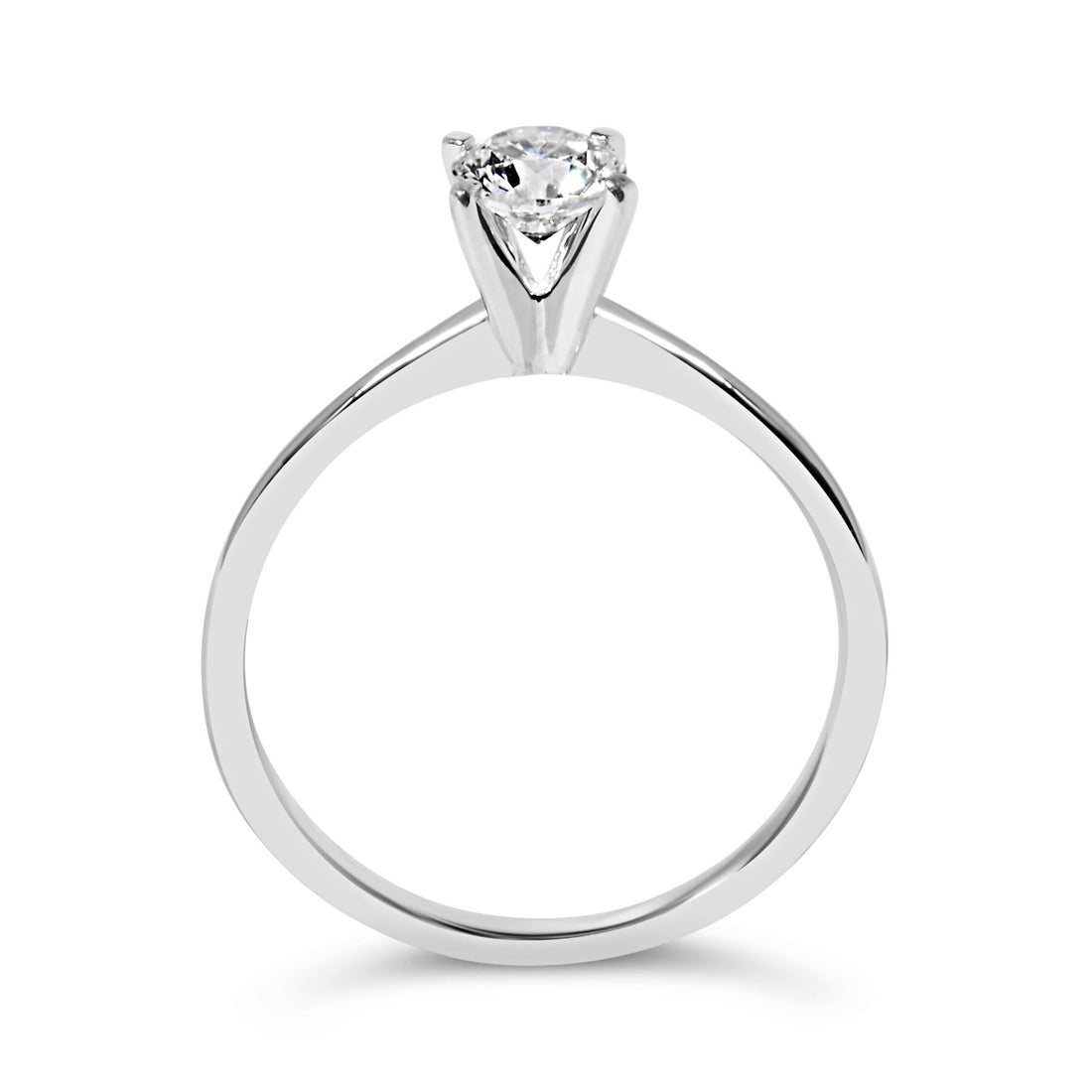 Silver ring with a single round diamond in a prong setting, simple and elegant design.
