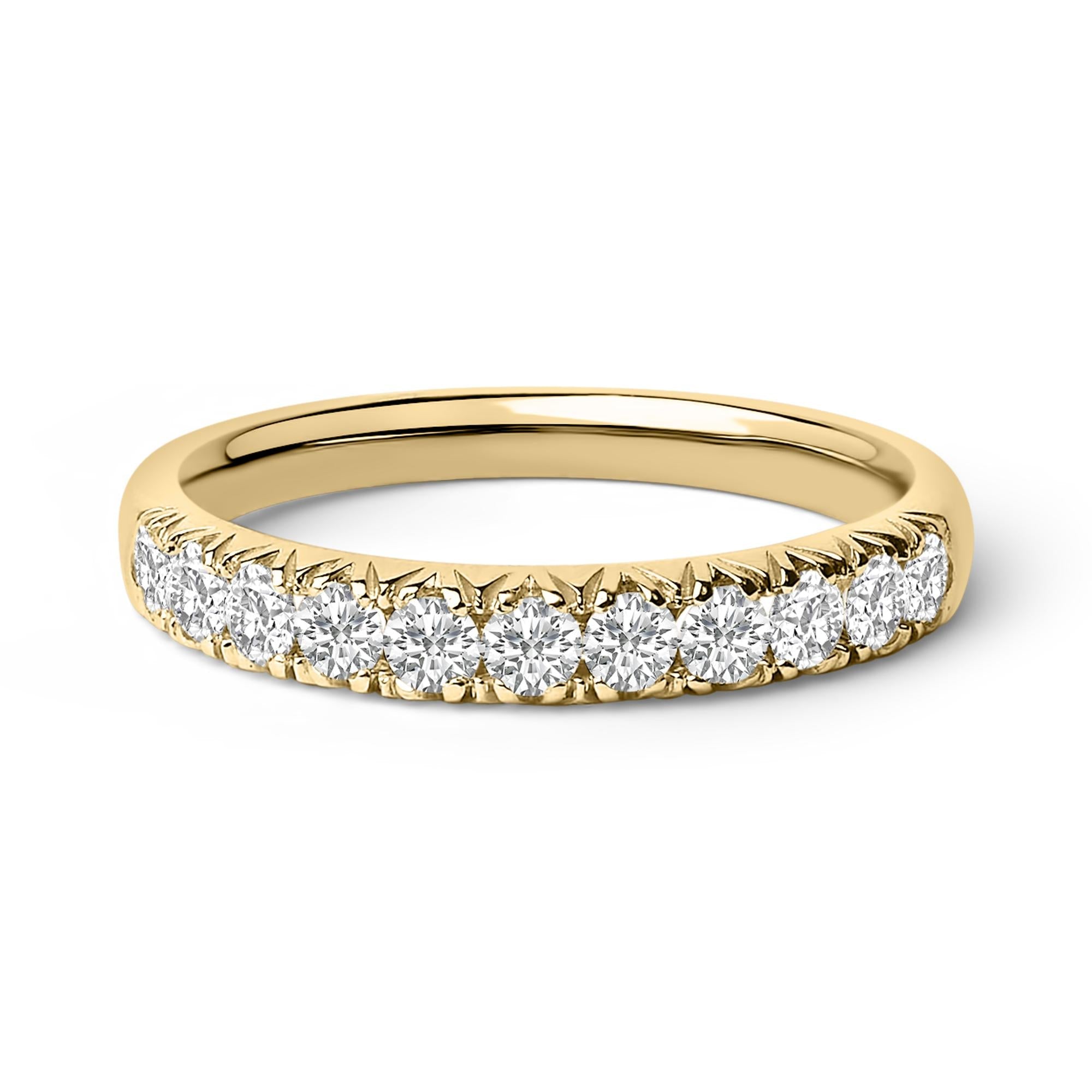 Gold ring with a row of sparkling round diamonds set halfway around the band.