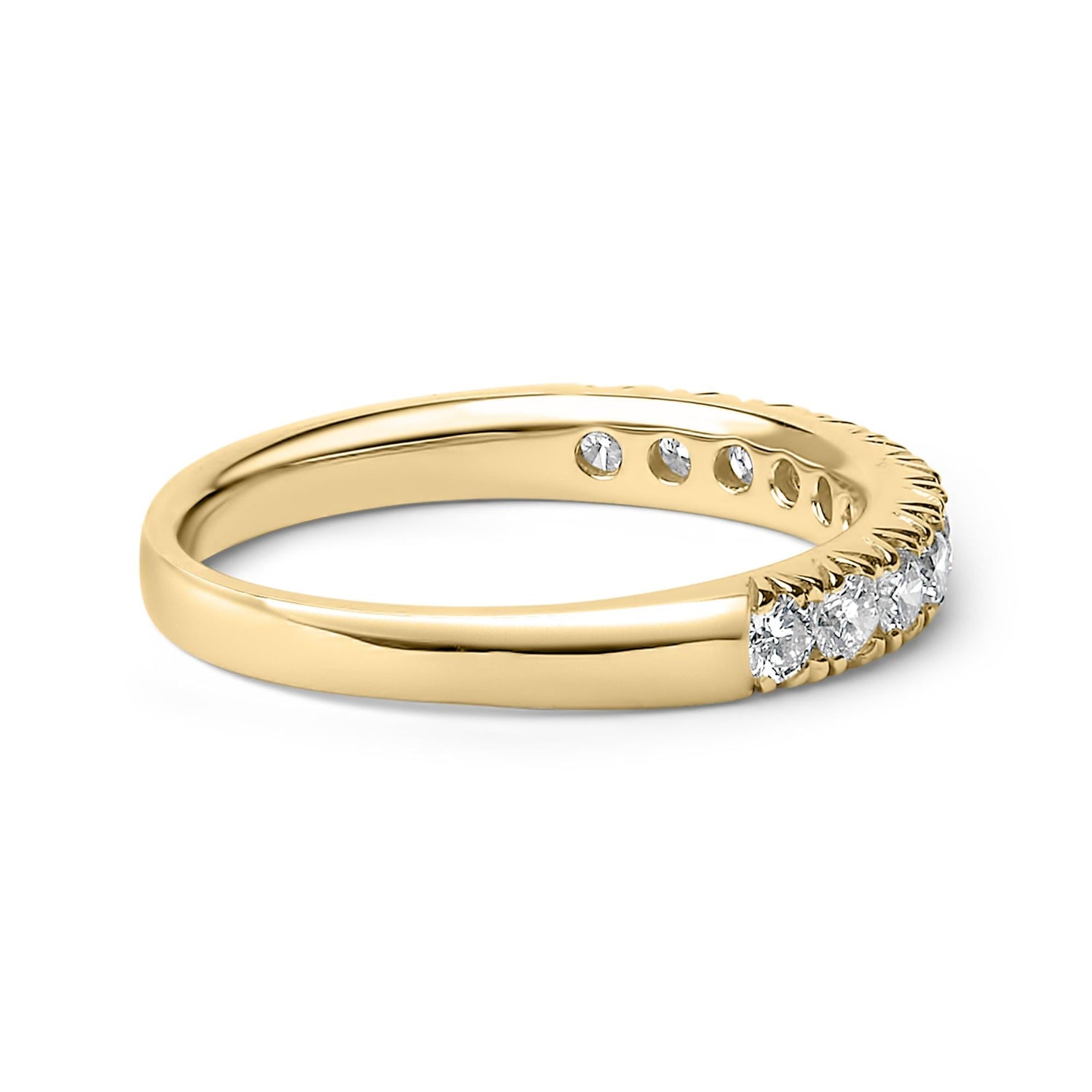 Gold ring with a row of sparkling diamonds set on the top half, glossy finish.