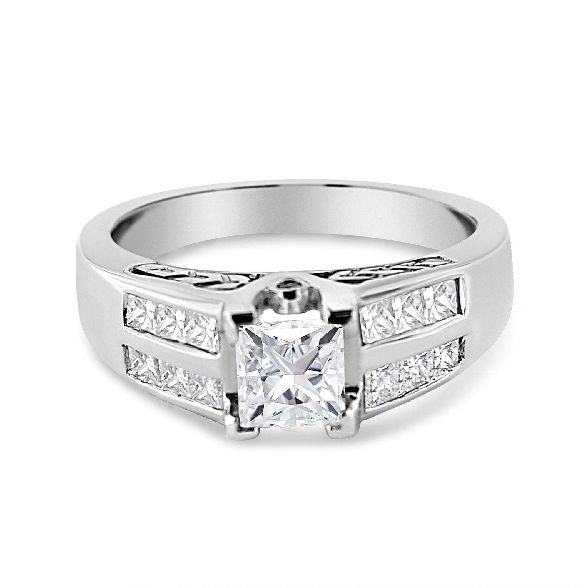 Silver ring with a square diamond centerpiece, accented by smaller diamonds on the band.