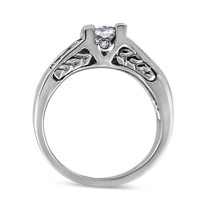 Silver ring with intricate leaf and star patterns on the band, featuring a central diamond.