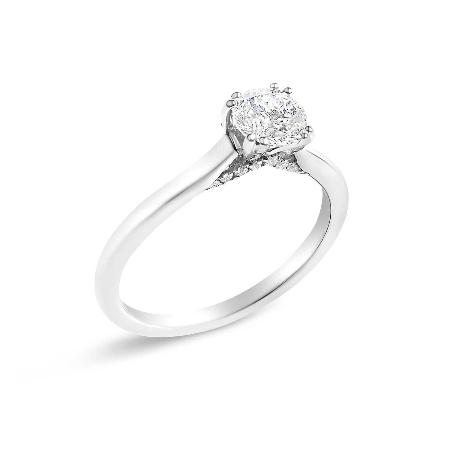 Silver ring with a large round diamond in a prong setting, twisted band featuring small accent stones.