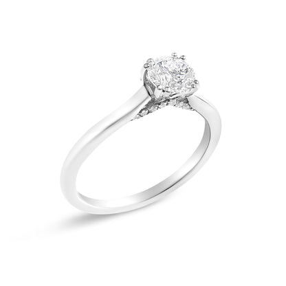 Silver ring with a large round diamond in a prong setting, twisted band featuring small accent stones.
