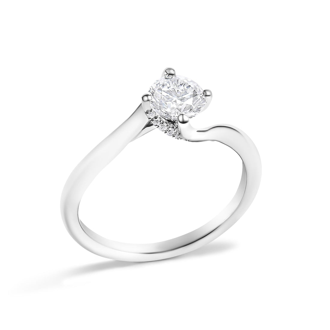 Silver ring with a round diamond centerpiece and small side stones, featuring a twisted band design.