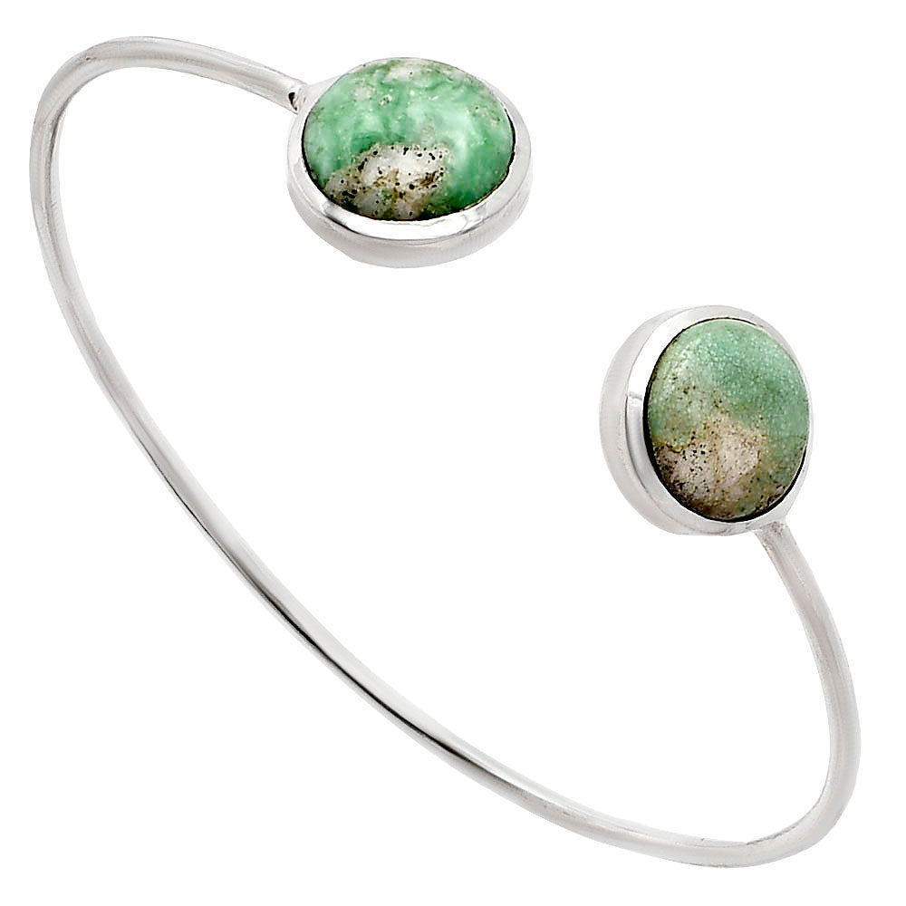 Silver open bangle bracelet with two round green stones at each end.