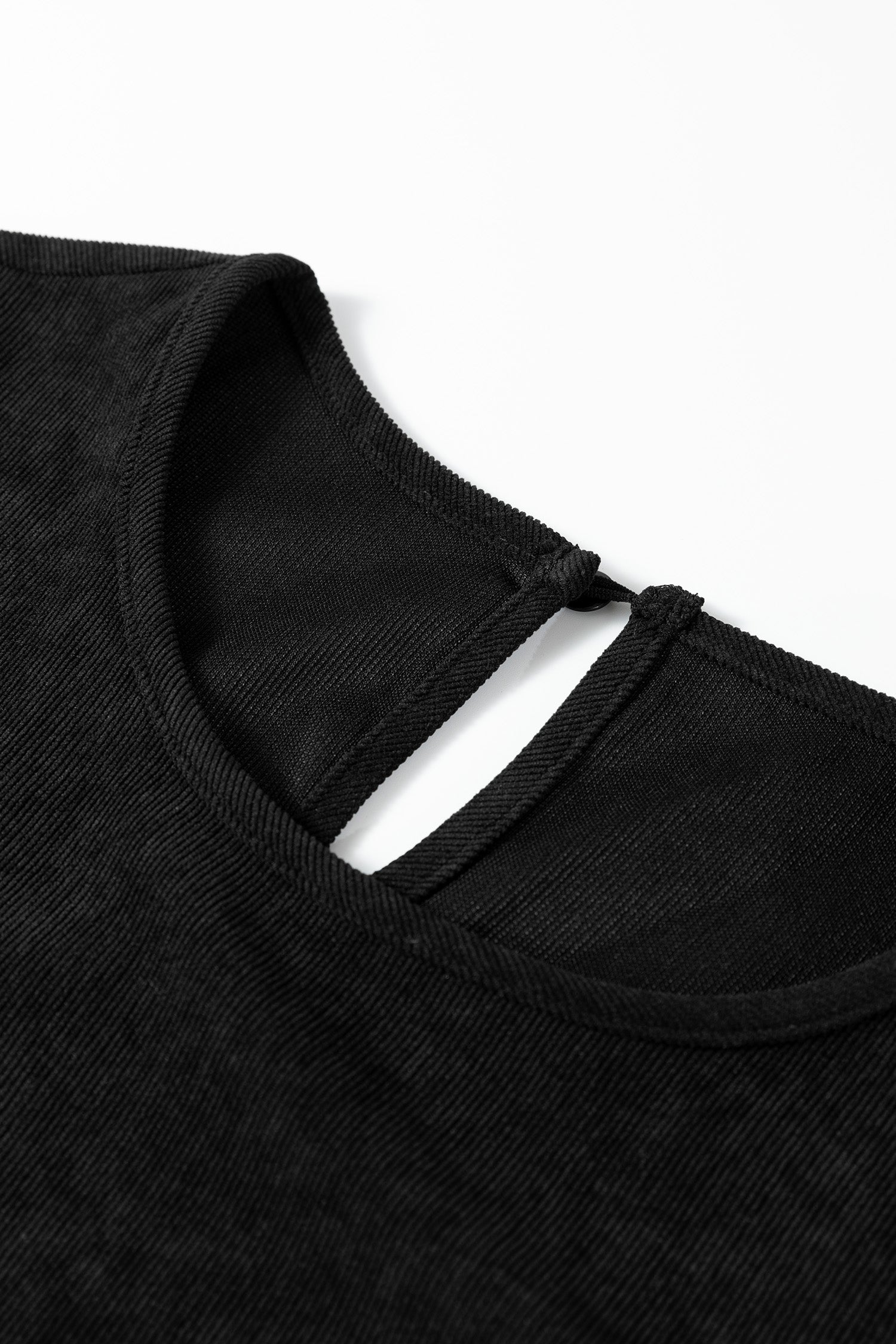 Black ribbed fabric top with a round neckline and a keyhole back button closure.