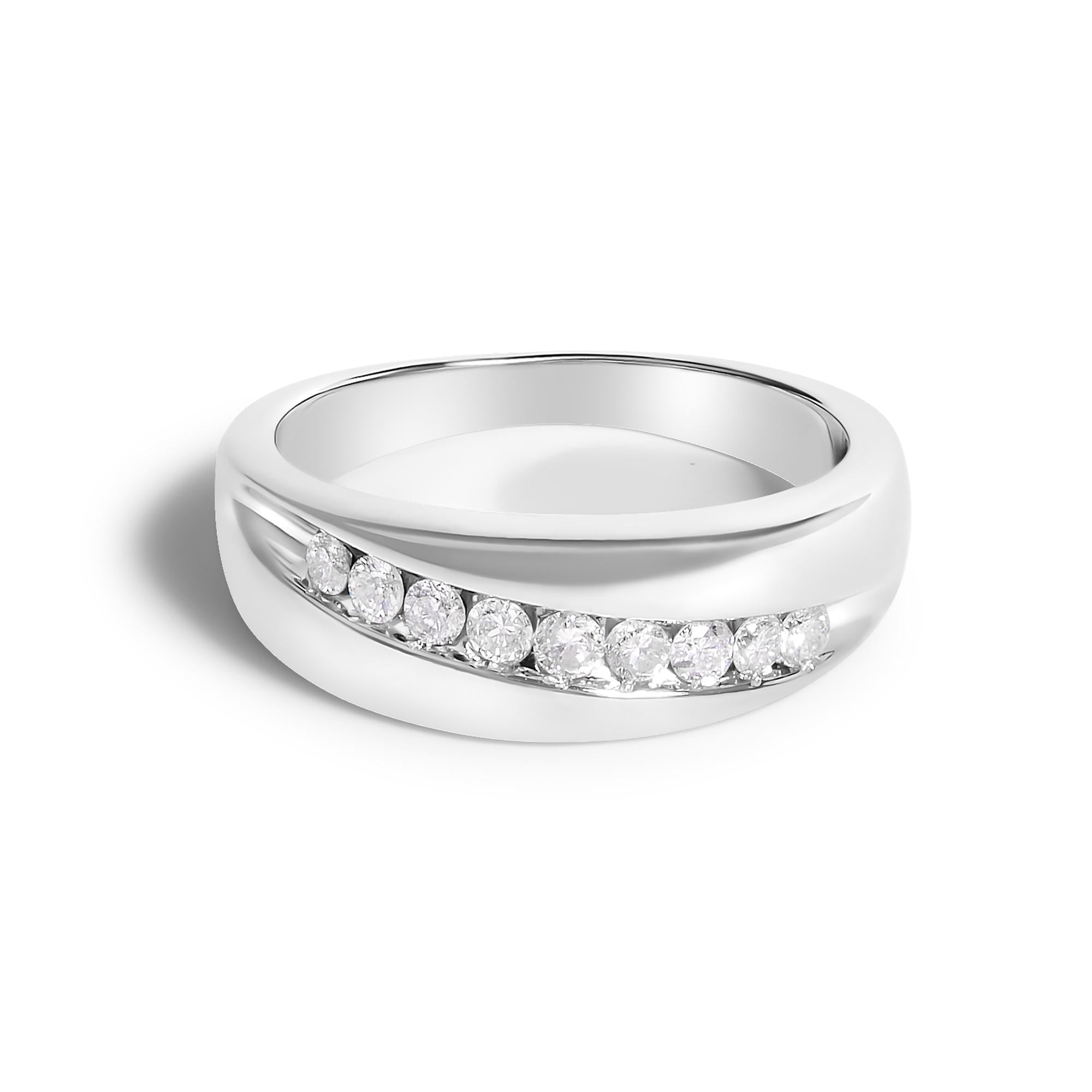 Silver ring with a smooth band, featuring a row of small, sparkling diamonds diagonally embedded.