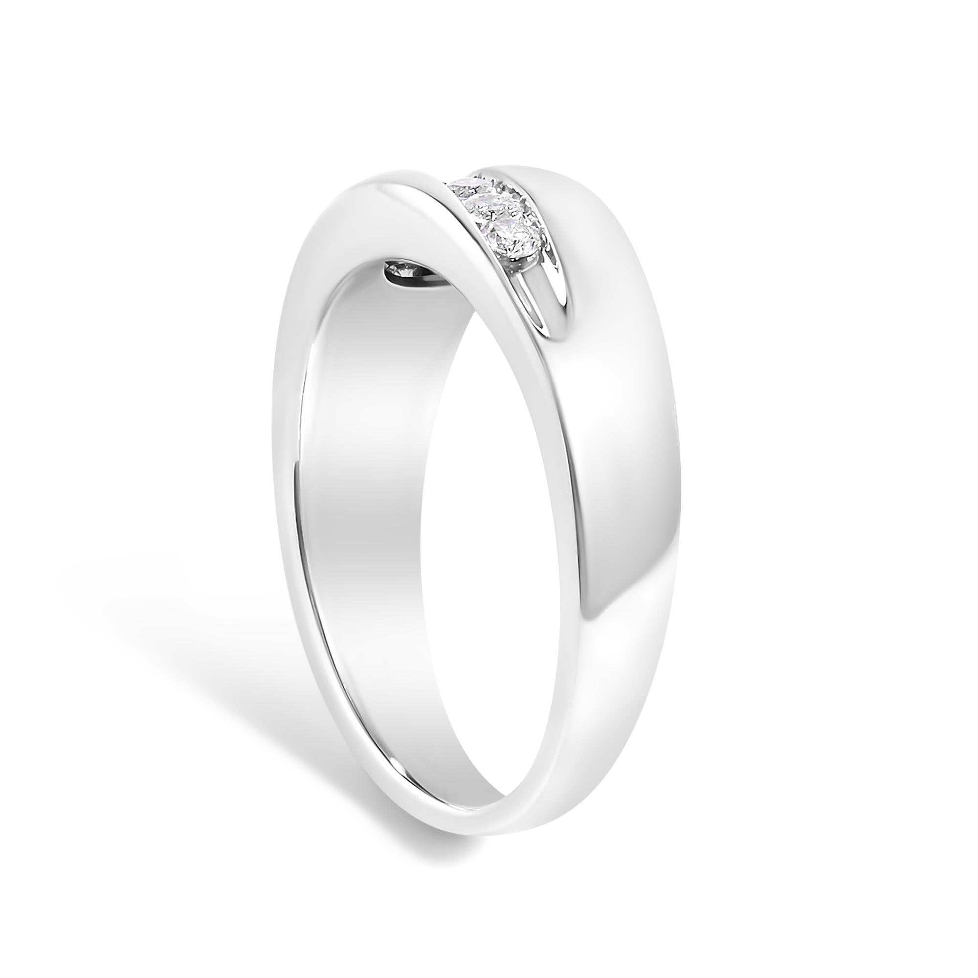 Elegant silver ring with a single diamond in a smooth, modern design.