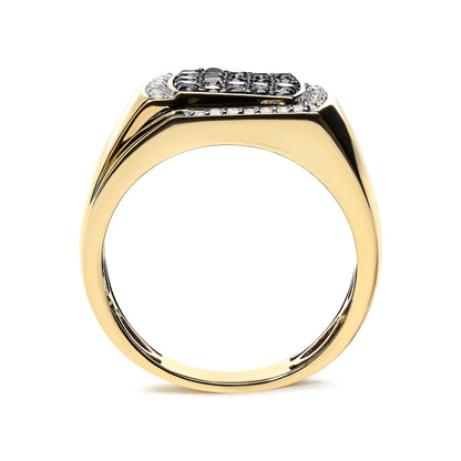 Gold ring with a flat top, set with black stones and small clear stones in a central design.