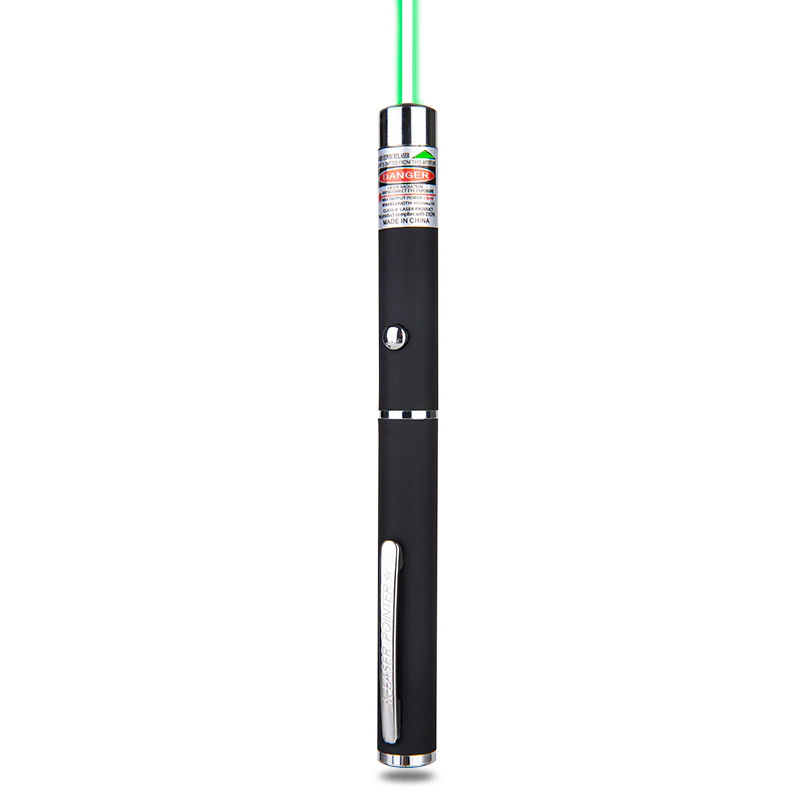 Black laser pointer with chrome accents, emitting a green beam from the top, red warning label visible.