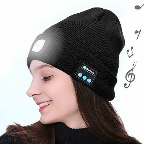 Woman wears a black Bluetooth beanie with a LED light and musical notes in the background.