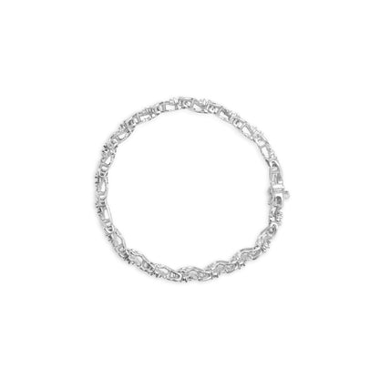Silver bracelet with intricate chain links in a circular shape on a white background.