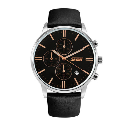 Black watch with a silver case, gold markers, sub-dials, date display, and black leather band.
