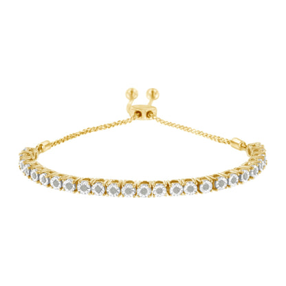 Gold bracelet with a chain and adjustable clasp, adorned with sparkling round-cut clear stones.