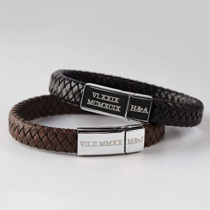 Two leather bracelets: one black, one brown, with engraved silver clasps on a gray background.