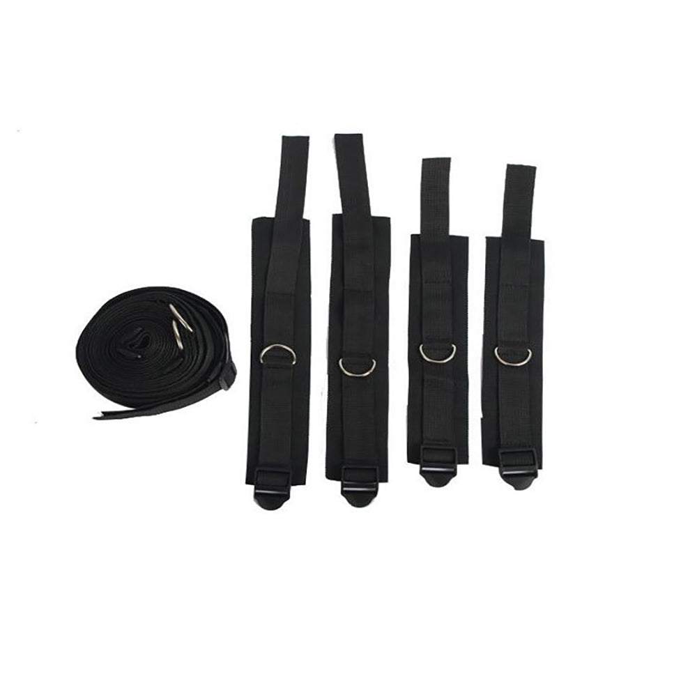 Black straps and coiled belt with metal clasps on white background.