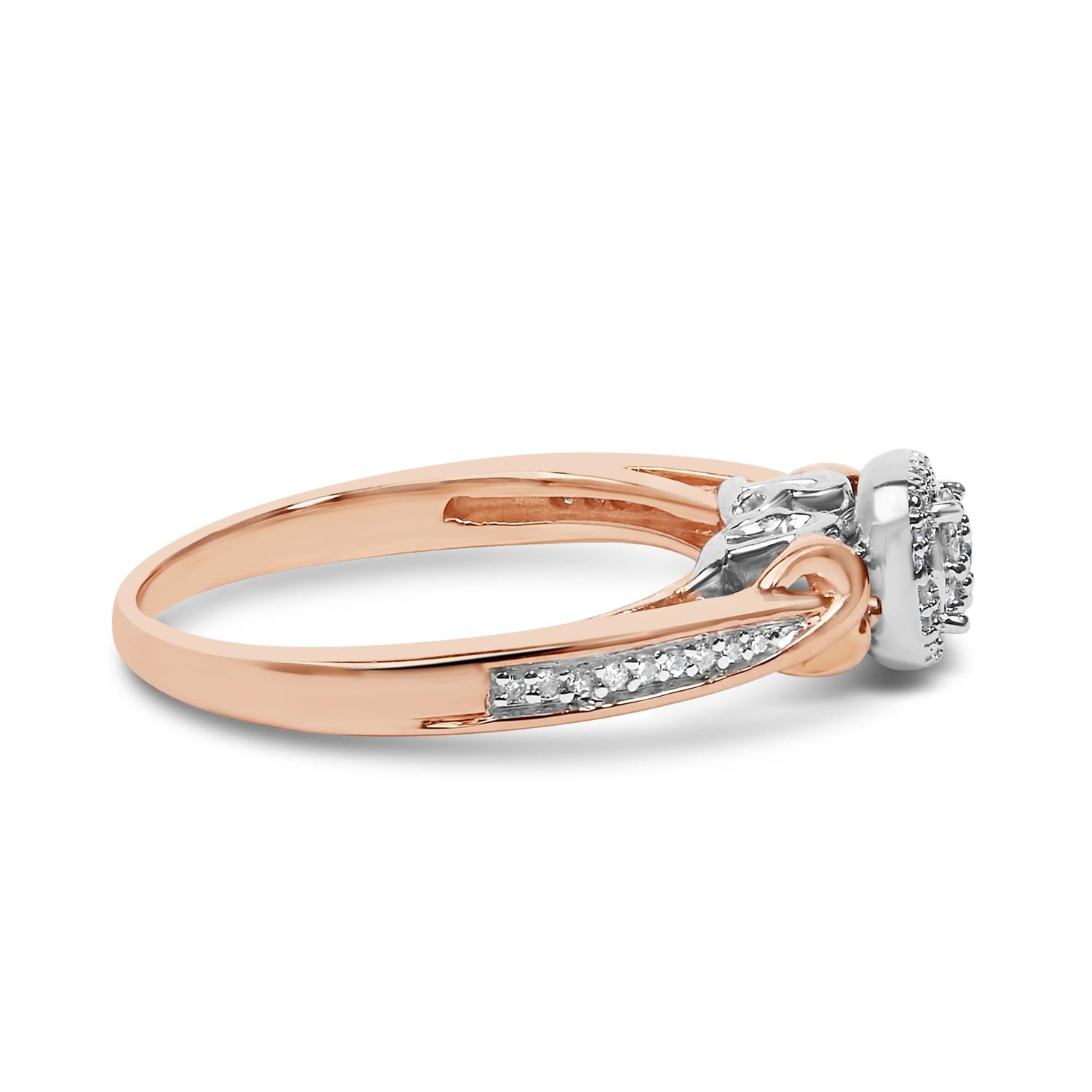 Rose gold ring with a diamond cluster and side stones in a split shank design.