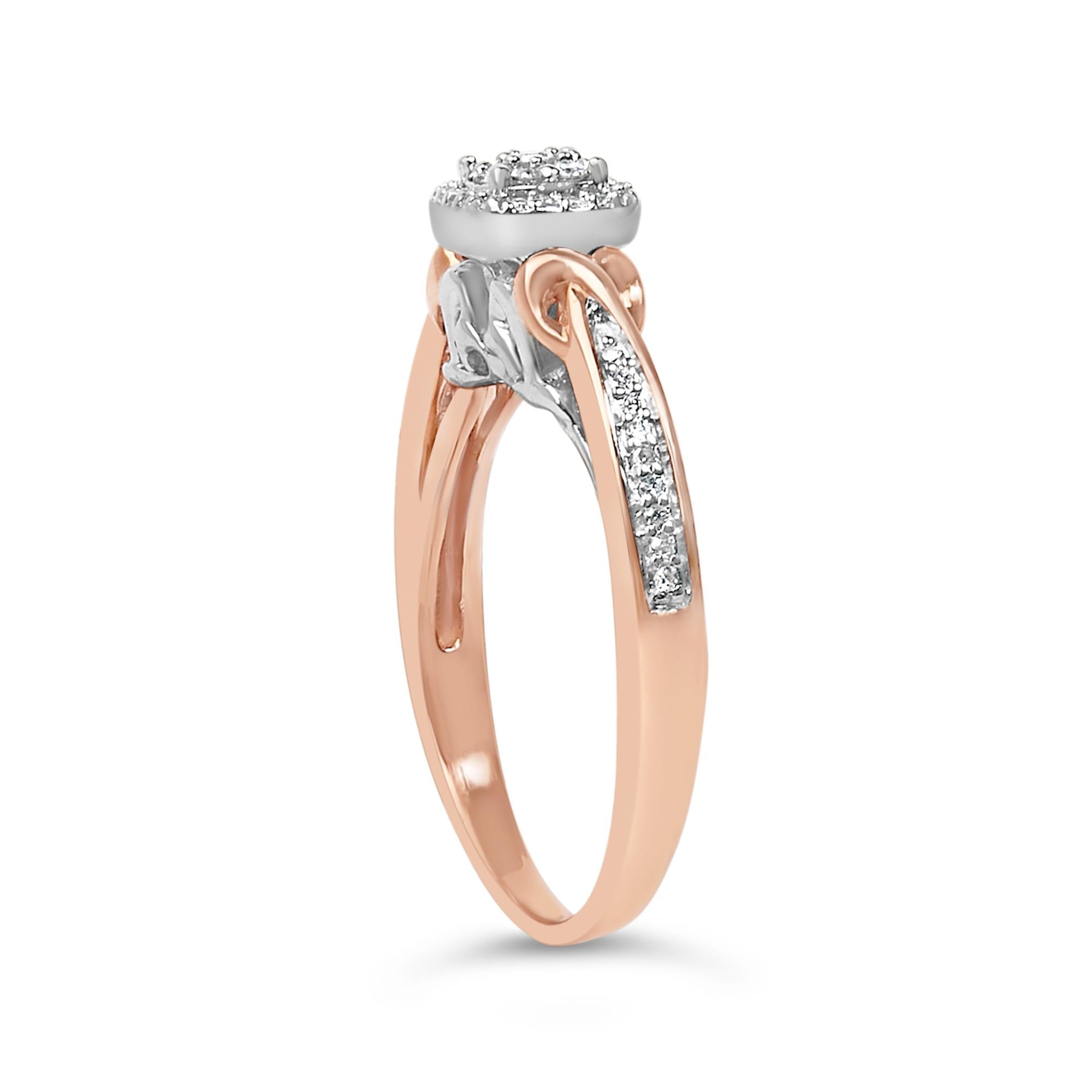 Rose gold ring with a split shank, diamond accents, and a round diamond cluster on top.