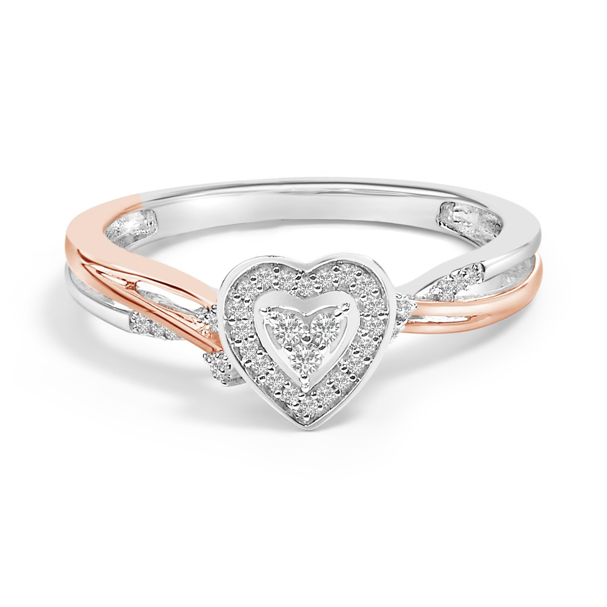 Silver and rose gold ring with intertwined bands and a diamond heart centerpiece.