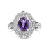 Silver ring with intricate patterns, featuring an oval purple gemstone at the center.