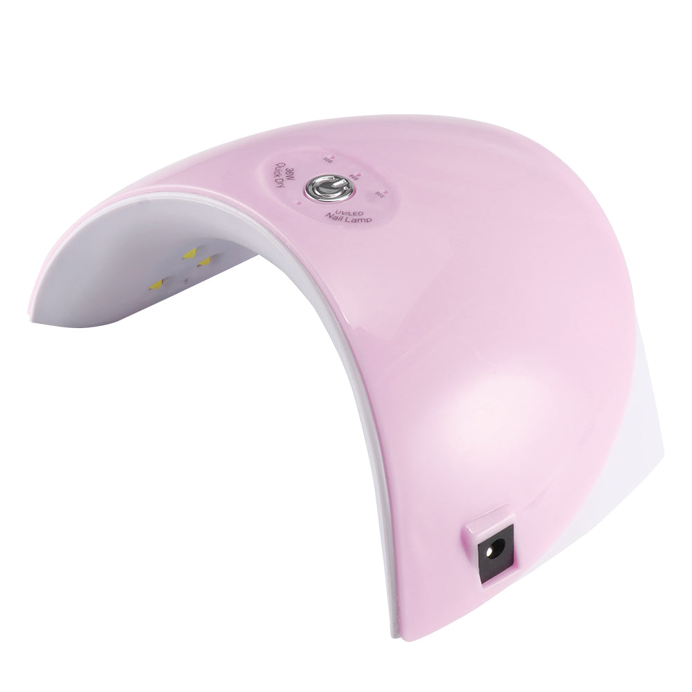 Pink and white UV nail lamp with LED lights and silver button on top.