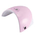 Pink and white UV nail lamp with LED lights and silver button on top.