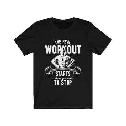 Black T-shirt with white text and muscular figure lifting a barbell, reads: "The real workout starts when you want to stop."