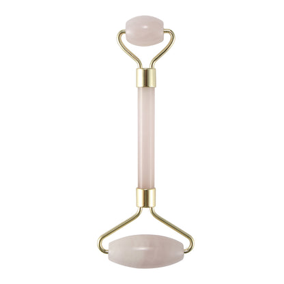 Pink facial roller with gold metal accents, featuring two smooth stone ends.