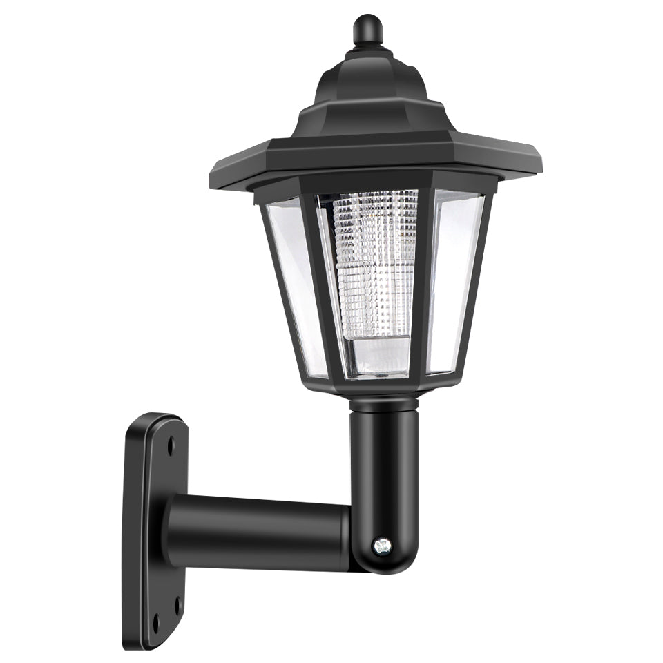 Black outdoor wall lantern with clear panels and hexagonal roof, mounted on a curved arm.