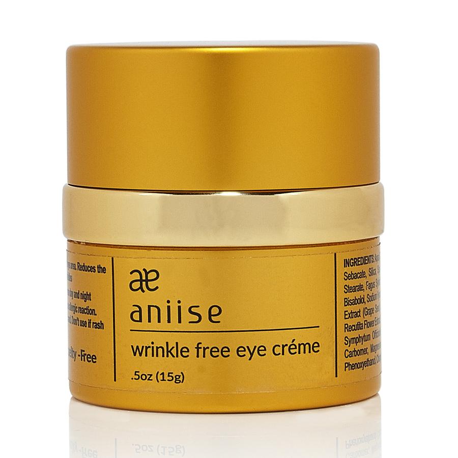 Golden jar with text "aniise wrinkle free eye crème," black font, shiny lid, 0.5 oz.