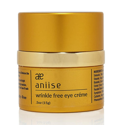 Golden jar with text "aniise wrinkle free eye crème," black font, shiny lid, 0.5 oz.