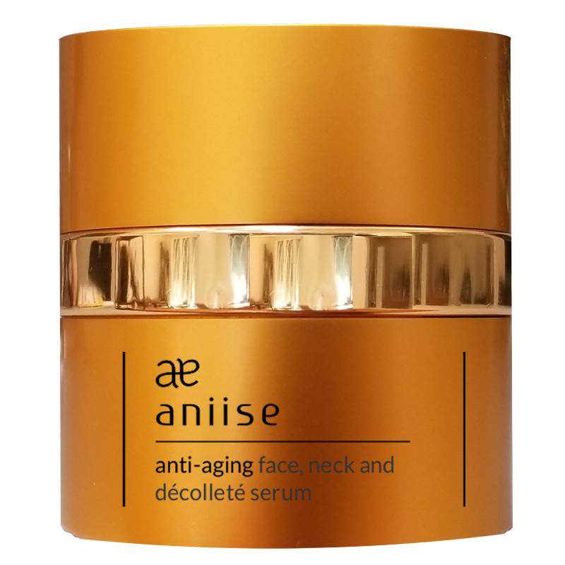 Golden cylindrical serum bottle with silver band, featuring text for anti-aging face and neck cream.