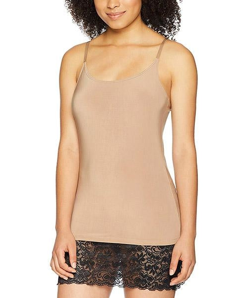 Woman wearing a tan camisole and black lace shorts with spaghetti straps, facing forward.