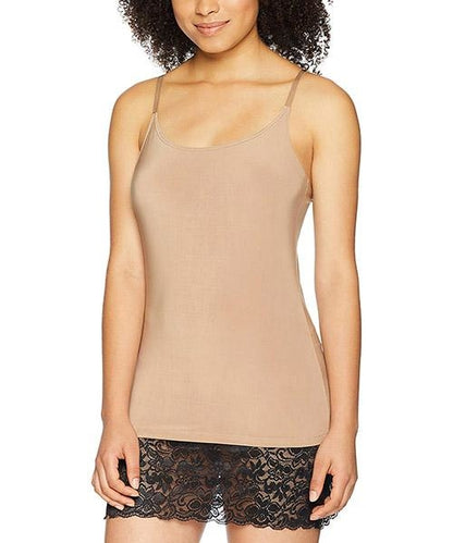 Woman wearing a tan camisole and black lace shorts with spaghetti straps, facing forward.