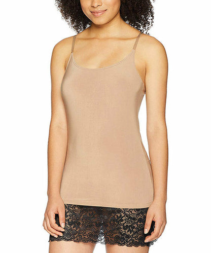 Woman in a beige camisole with thin straps and lace trim at the bottom, against a white background.
