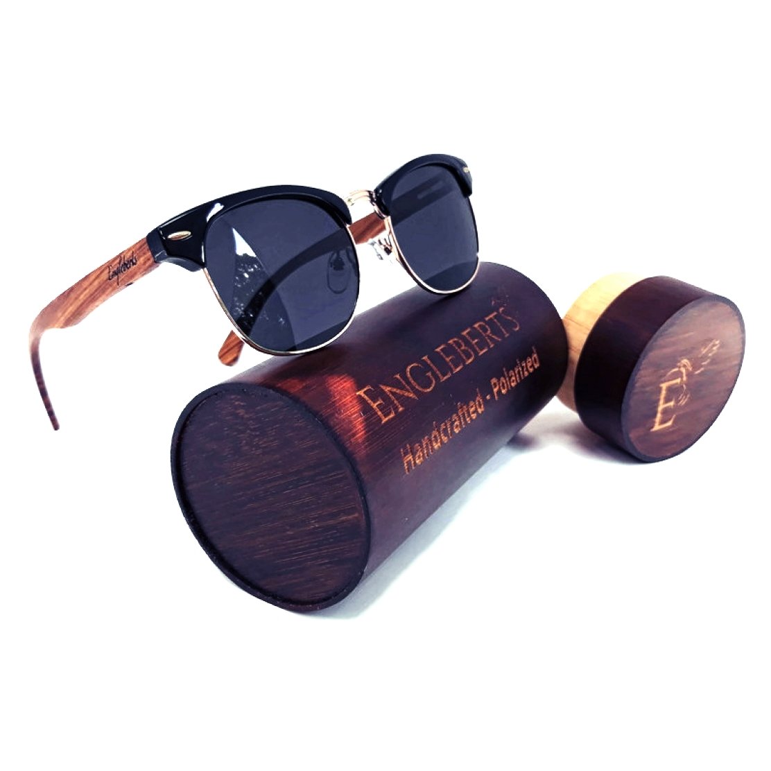 Sunglasses with dark lenses, black frame, and wooden arms on a wooden Engleberts case.