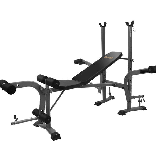 Black and gray adjustable weight bench with leg extension and barbell rack.